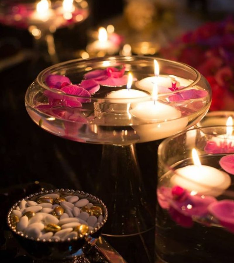 Floating candles and flowers for centre table lighting