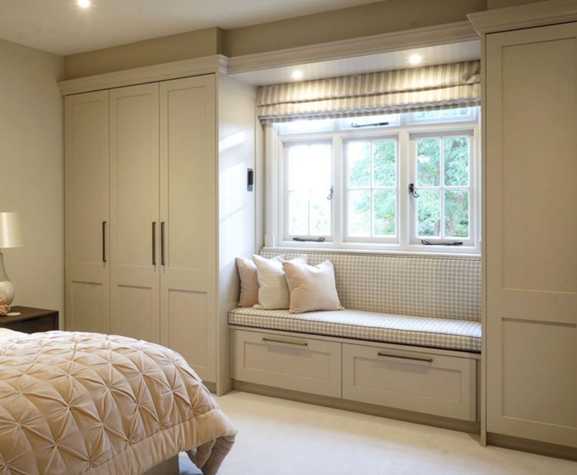 Wardrobes around a seating space  